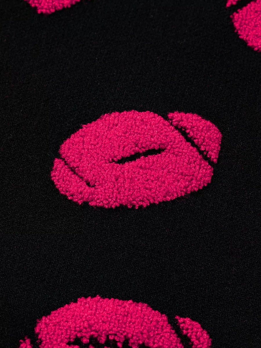 Black knit sweater with fuzzy pink lips pattern