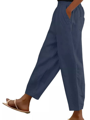 Navy wide-leg maternity pants with pockets and elastic waist, styled with sandals.