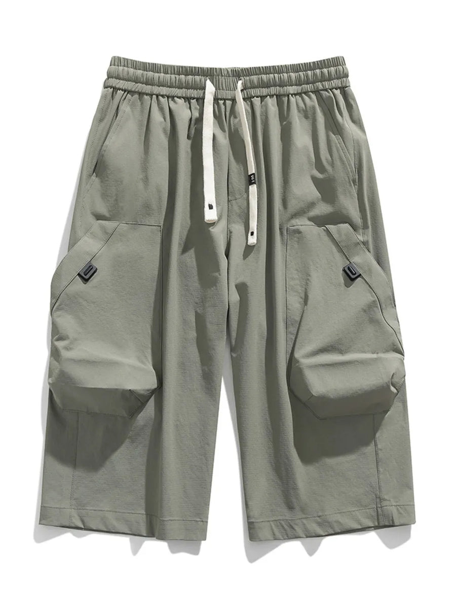 Light gray cargo capris with adjustable drawstring and large side pockets.