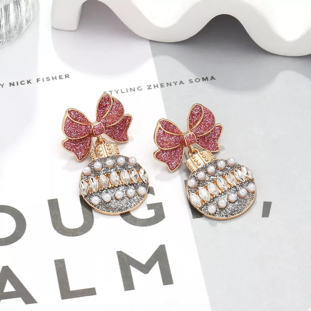 earrings in rose gold featuring bowknot detail and drop fit