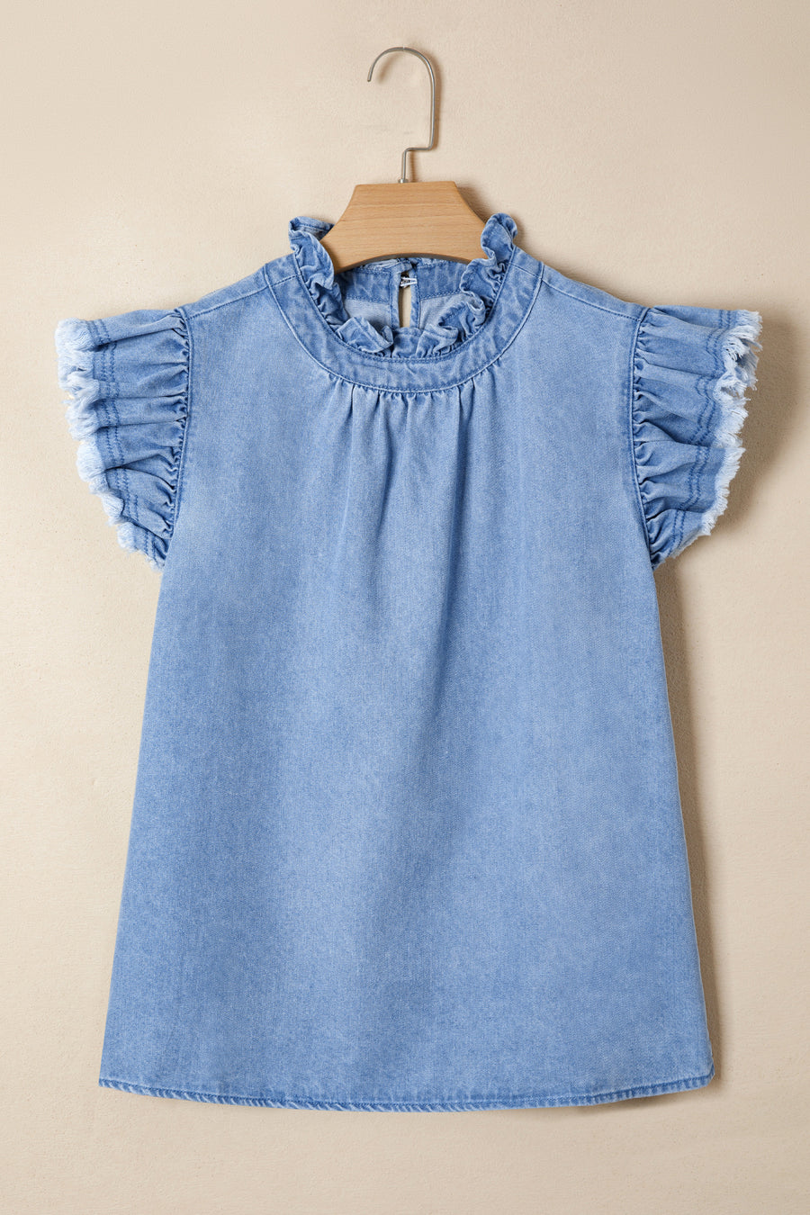 Frilled collar distressed denim top with ruffled cap sleeves and frayed hem.