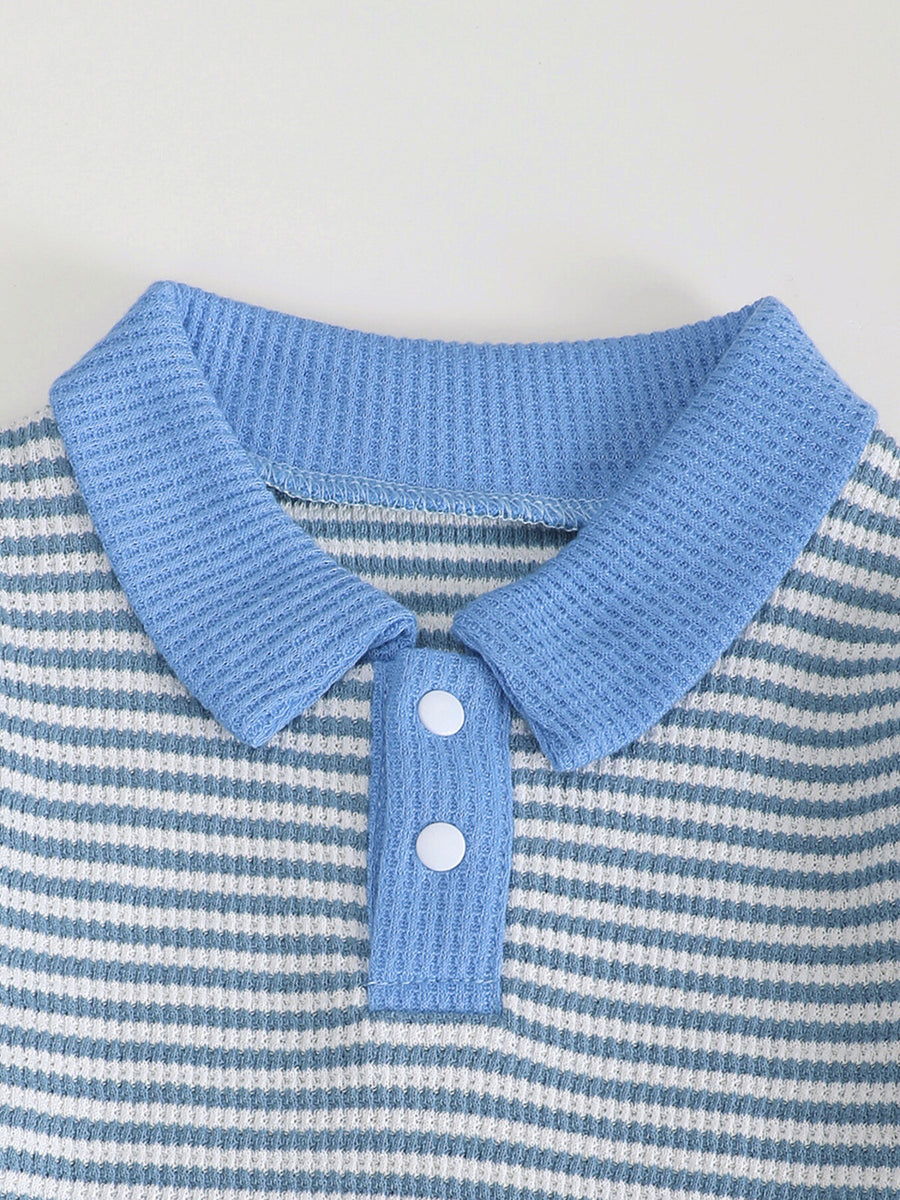 Children's blue and white striped polo shirt with waffle knit texture and two white buttons.