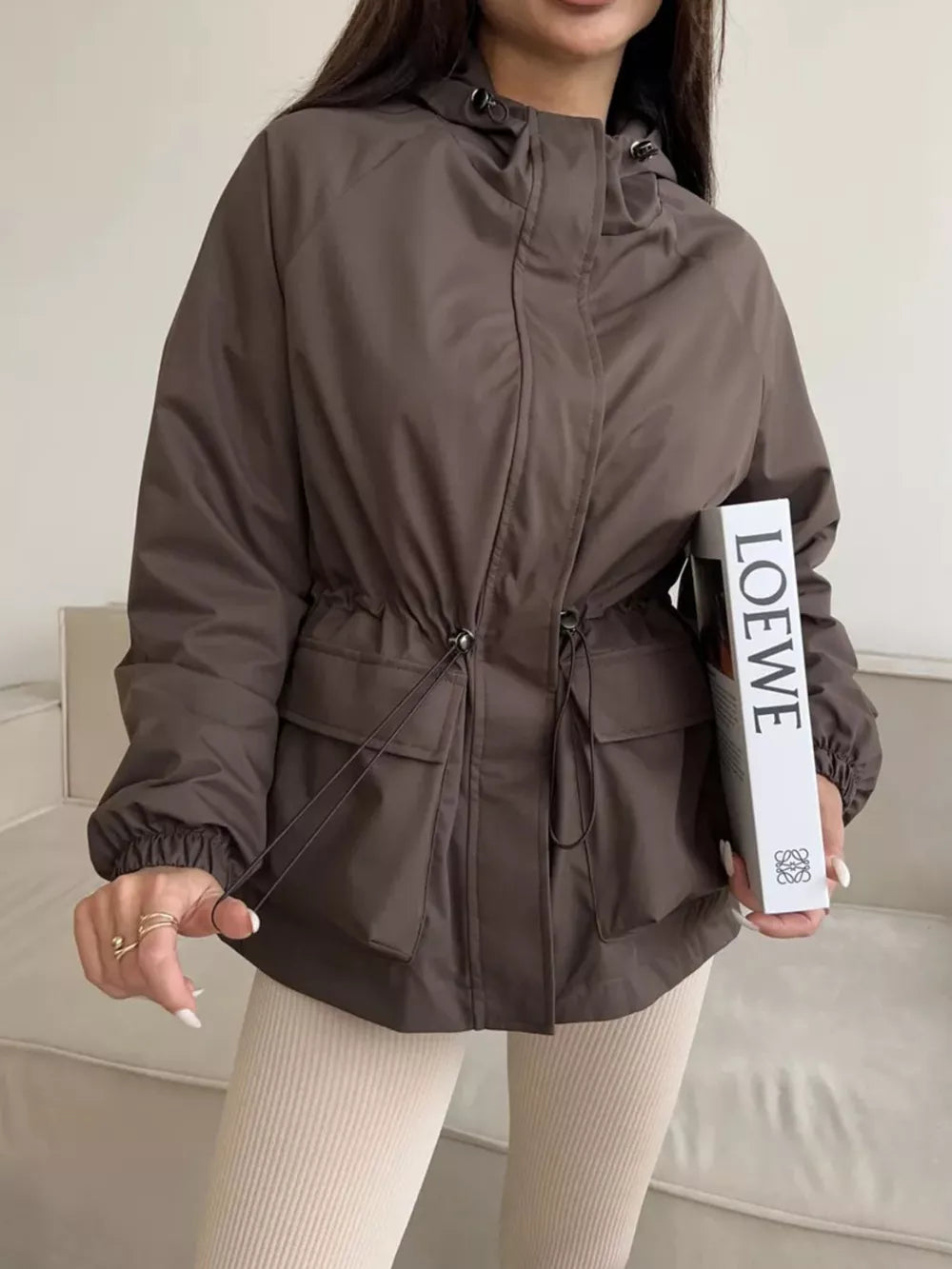 100% polyester Care instructions: Machine wash cold windbreaker in Black with relaxed silhouette