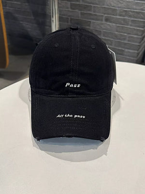 Black cotton baseball cap with embroidered slogans "pass" and "All the pass", distressed brim.