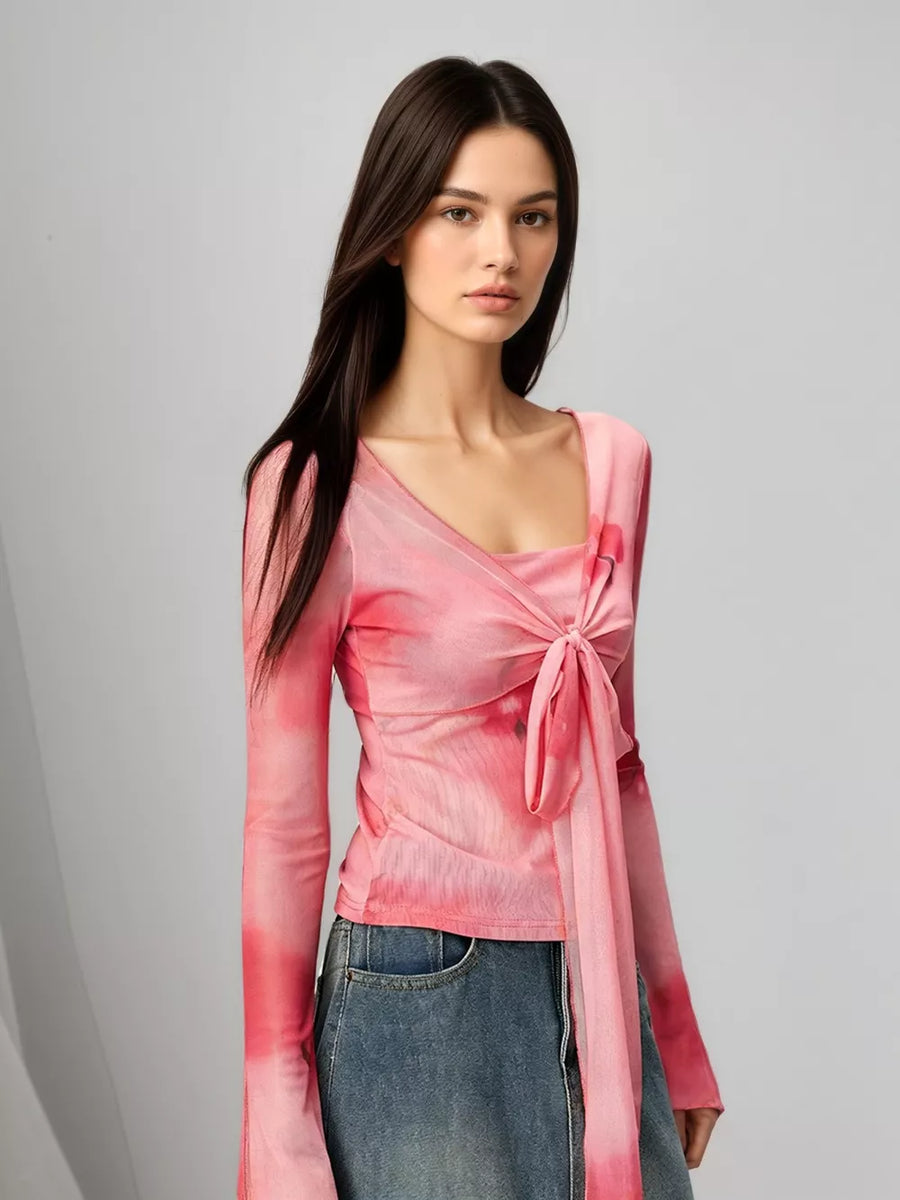 Pink watercolor tie-front t-shirt with flared sleeves and a square neckline.