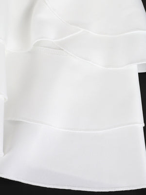 White tiered ruffled mini dress with a fitted bodice and elegant details.