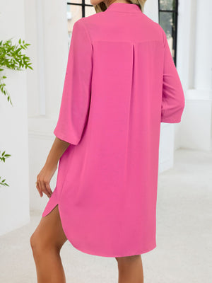 Fuchsia pink button-down shirt dress with band collar and 3/4 sleeves.