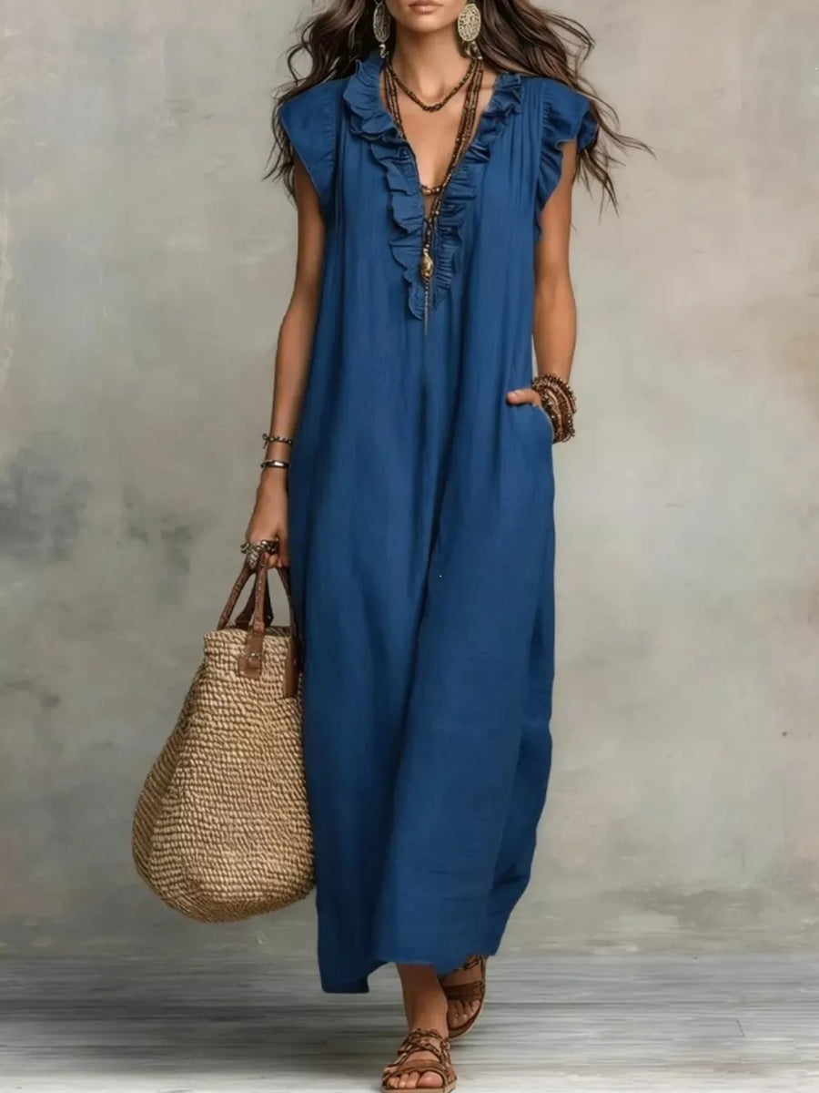 Blue ruffled V-neck maxi dress with pockets and short sleeves.