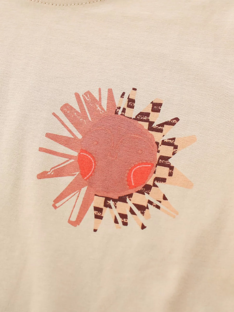 Toddler cotton set with a whimsical sun graphic in pink and beige with checkerboard accents.