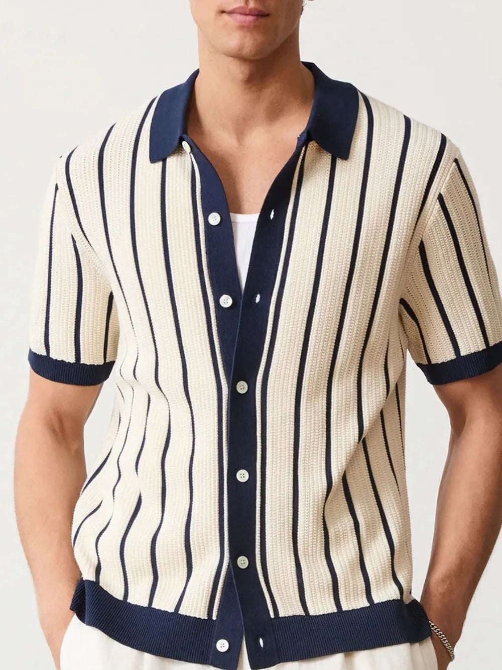 Textured stripe knit polo shirt in navy with contrast trim and button front.