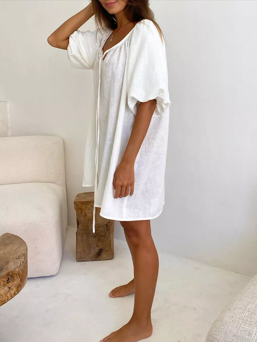 100% polyester Care instructions: Machine wash cold mini dress in ivory with relaxed silhouette