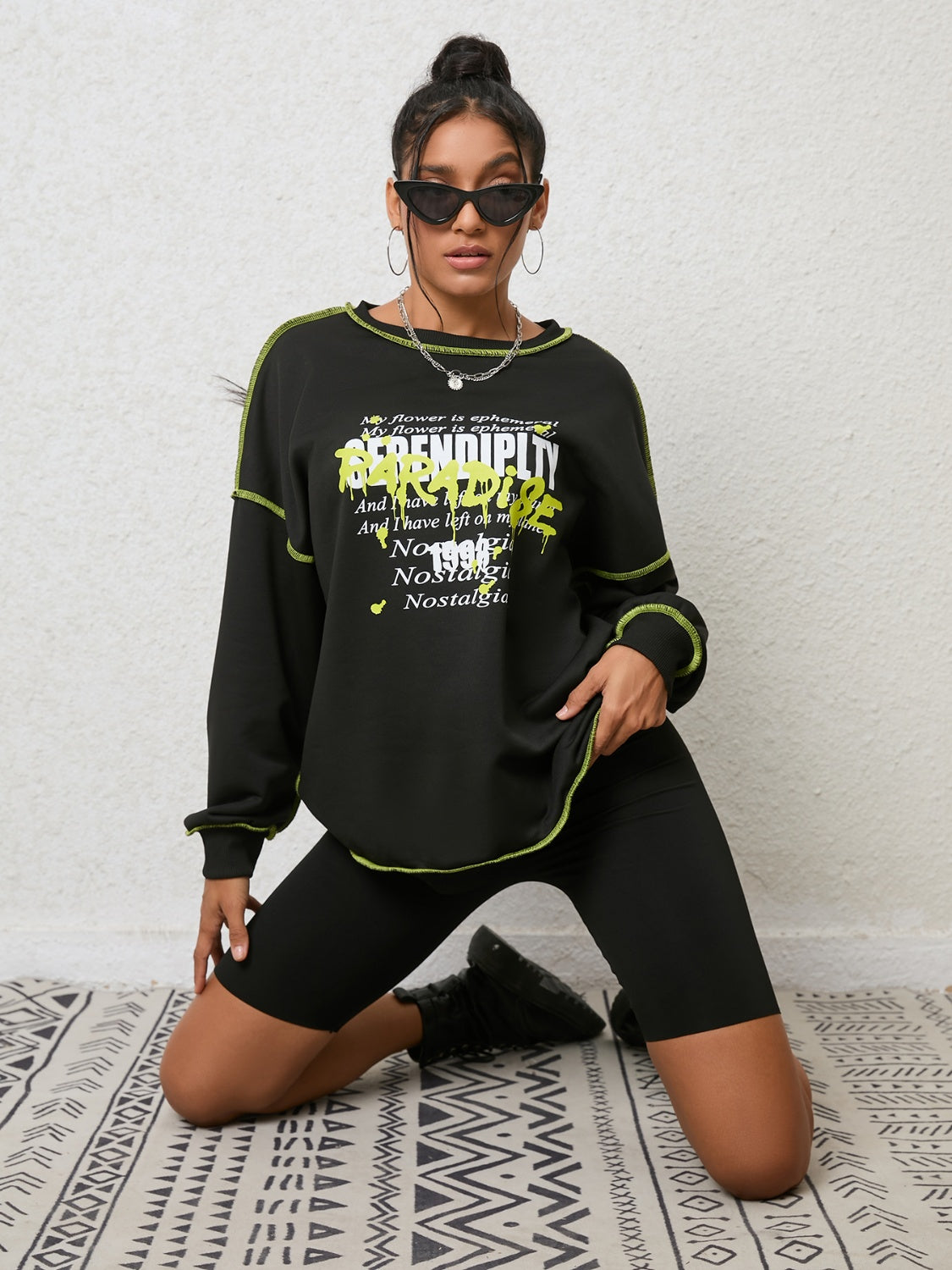 Black graphic sweatshirt with contrast stitching and crew neck
