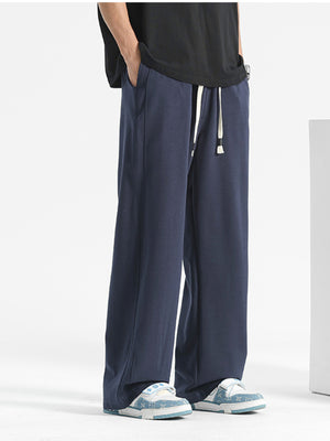 Men's navy blue loose-fit drawstring sweatpants with pockets