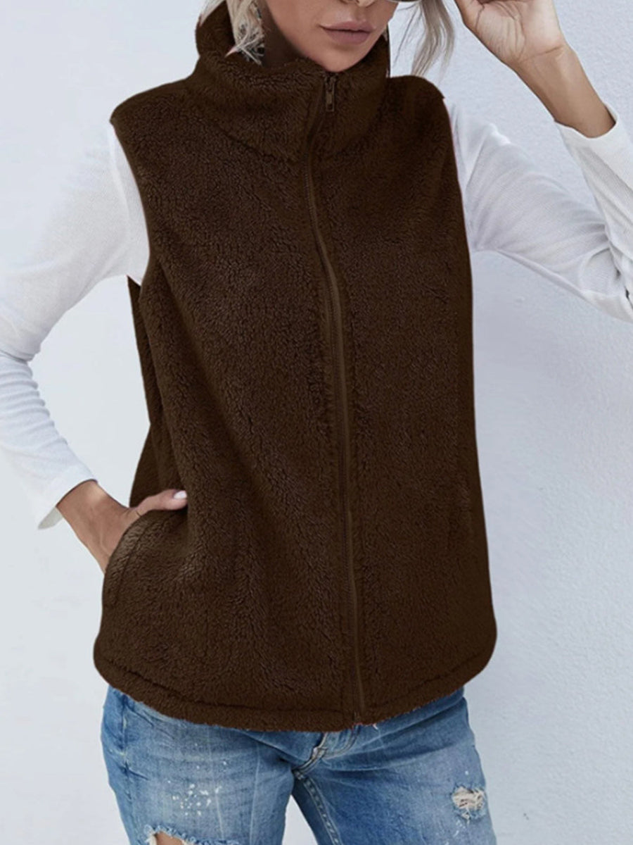 Chocolate teddy fleece stand-collar vest with zip closure and pockets.