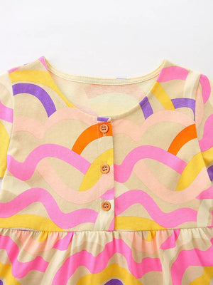Toddler abstract print cotton blend dress with button front and ruffled hem.