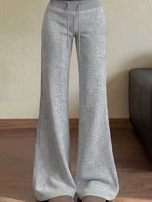 flare pants in light gray featuring drawstring waist and flared fit