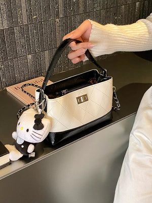 crossbody bag in ivory featuring quilted and boxy fit