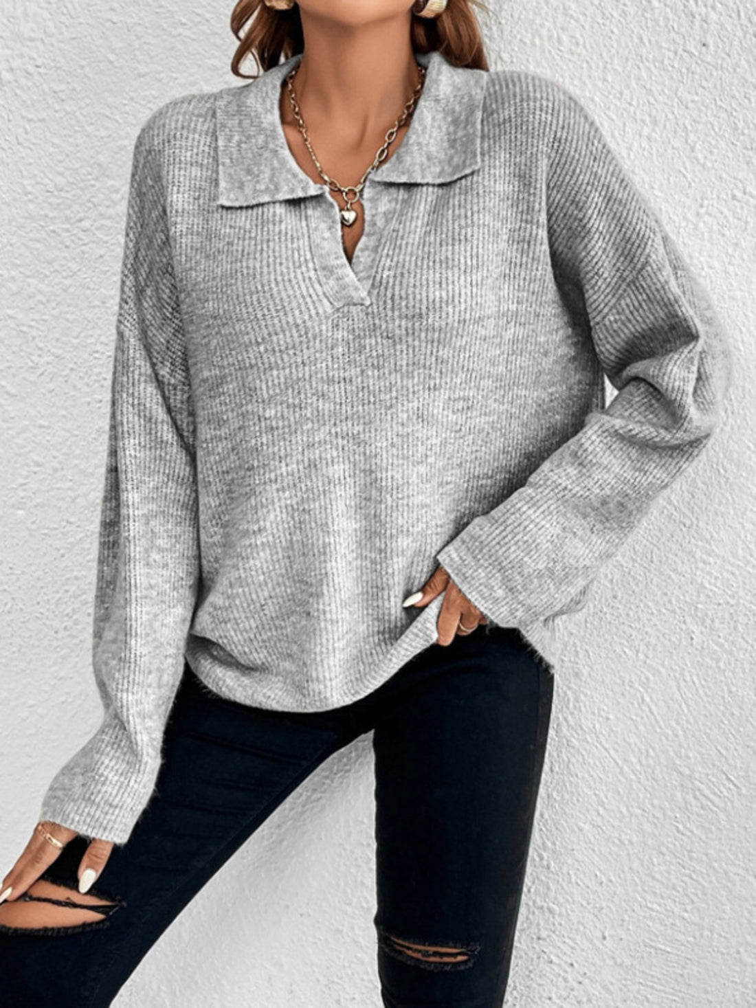 100% polyester Care instructions: Machine wash cold pullover sweater in Black with relaxed silhouette