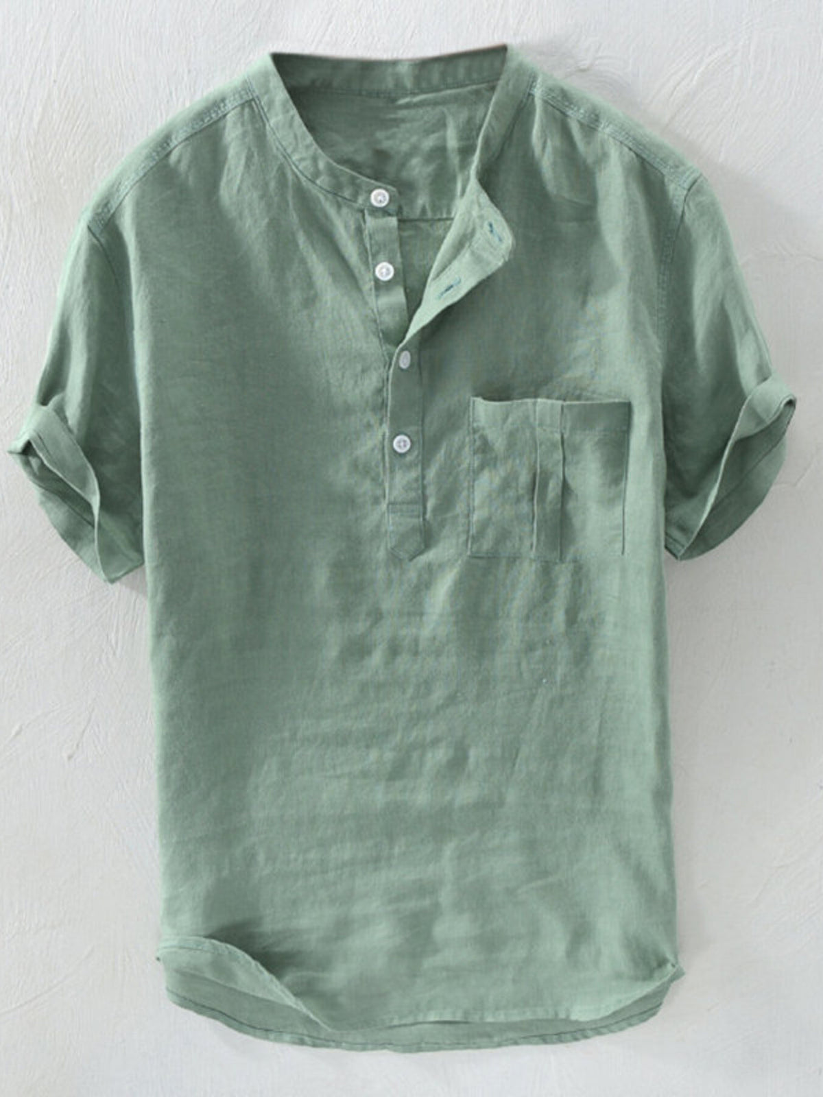 Men's relaxed fit short sleeve band collar shirt in army green with buttoned placket and chest pocket.