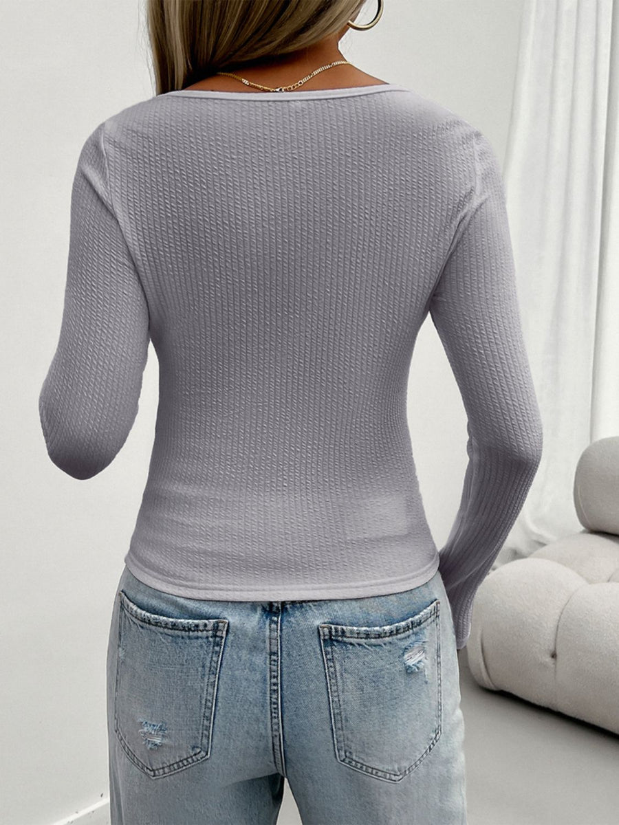 Gray textured knit scoop neck sweater with lace detail, long sleeves.