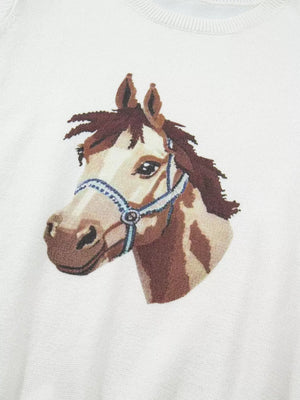 White acrylic sweater with a brown horse head graphic and blue halter detail.