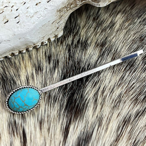 Turquoise blossom hair pin with oval turquoise stone and silver alloy setting.