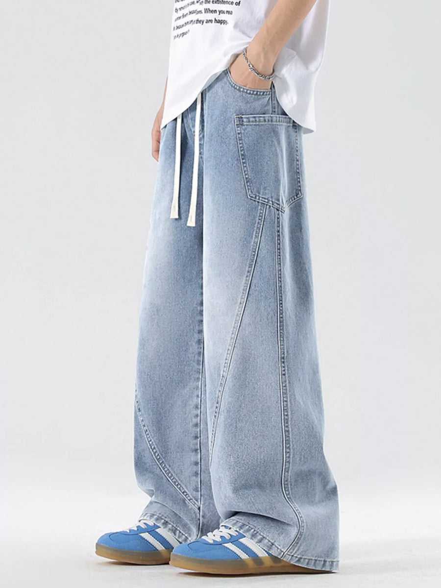 Light blue vintage-inspired wide-leg jeans with drawstring and pockets.