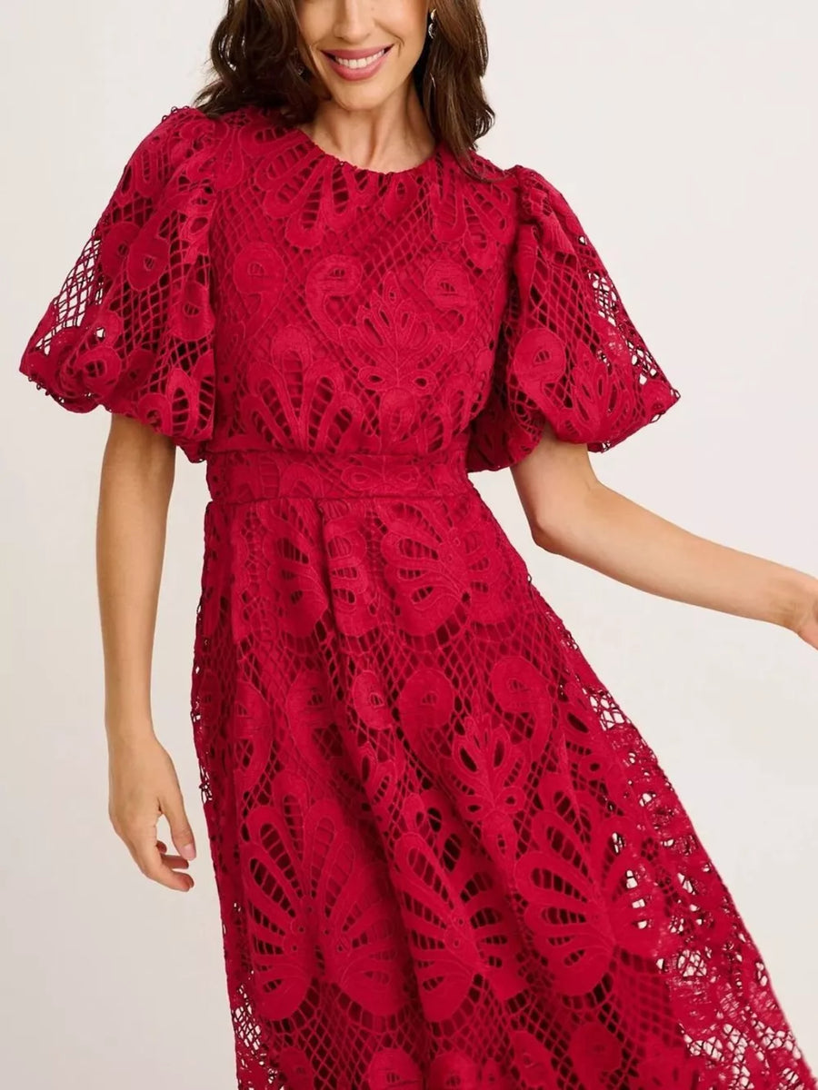 Wine red lace midi dress with puff sleeves and intricate cutout pattern.