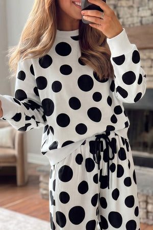 black pajama set featuring drawstring and polka dot