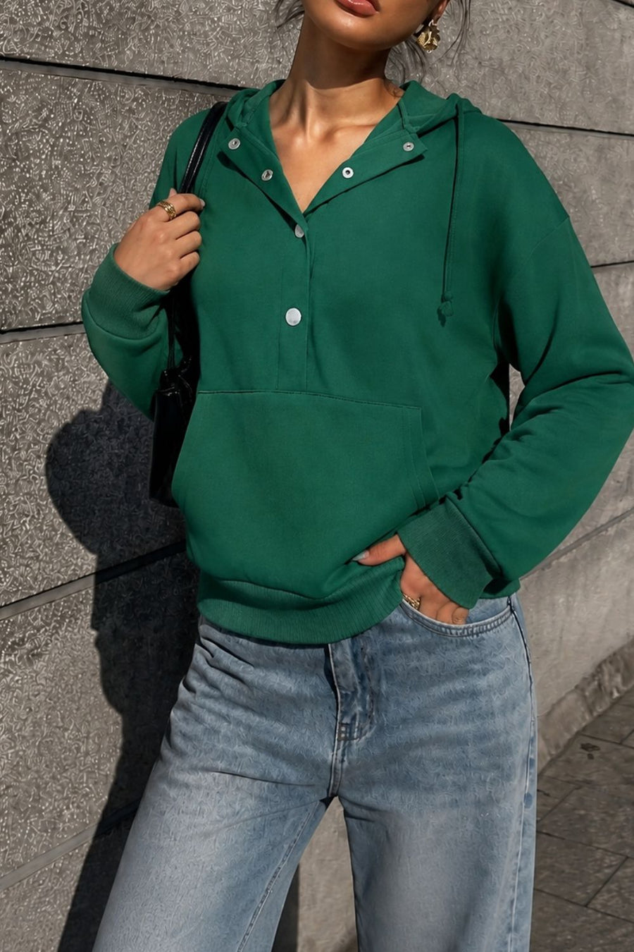 100% polyester Care instructions: Machine wash cold pullover hoodie in Dark Green with relaxed silhouette