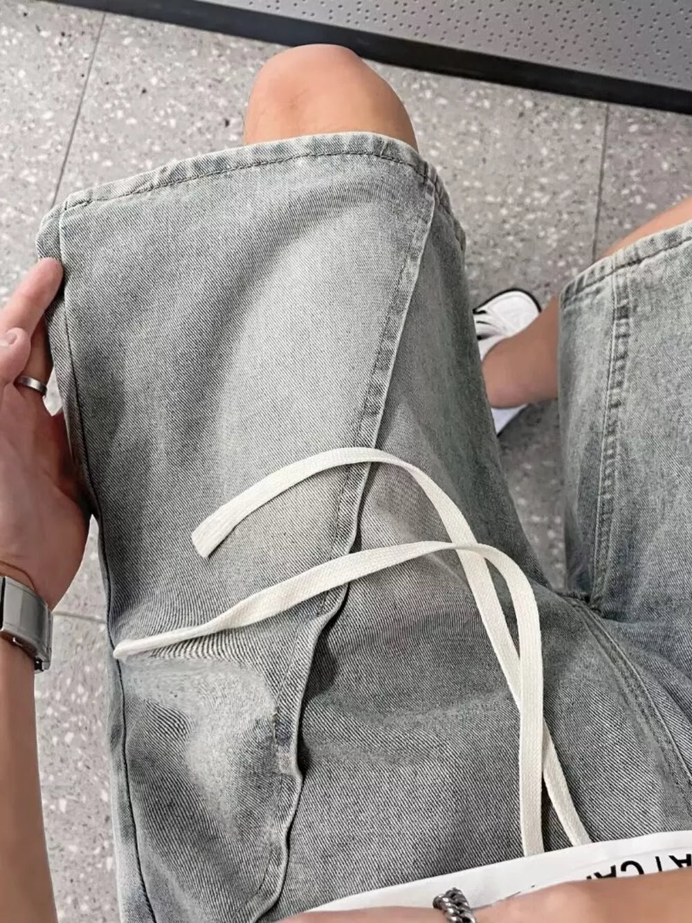 Light blue denim shorts for men with drawstring and pockets.