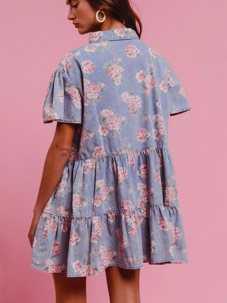 Light blue floral denim mini dress with ruffled tiers and short puff sleeves.