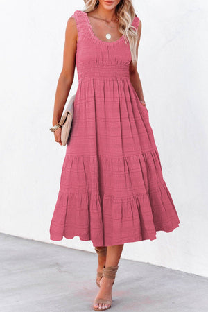 Deep rose smocked midi dress with tiered skirt and pockets.