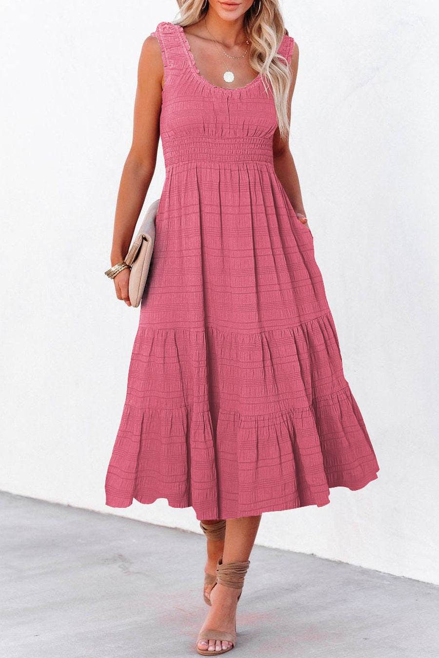 Deep rose smocked midi dress with tiered skirt and pockets.
