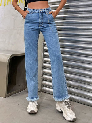 Light wash denim jeans with chain detail and frayed hem