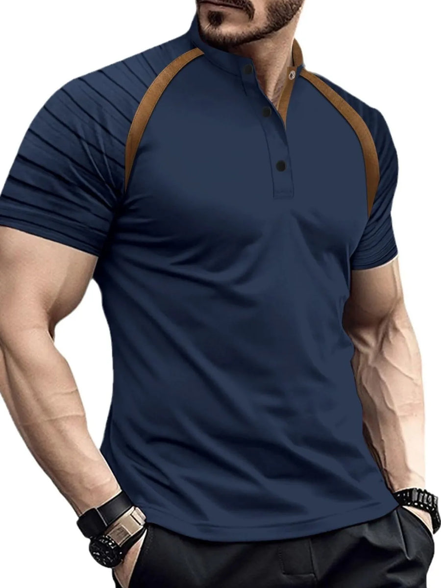 Navy polo shirt with contrast brown raglan sleeves and mandarin collar.