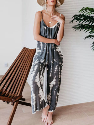 Gray tie-dye wide-leg jumpsuit with spaghetti straps and a scoop neck.