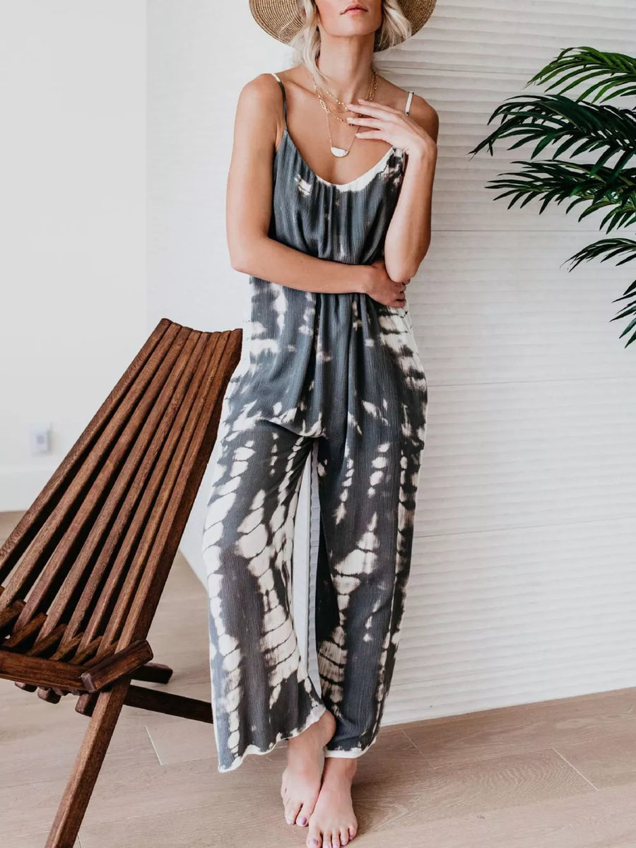 Gray tie-dye wide-leg jumpsuit with spaghetti straps and a scoop neck.