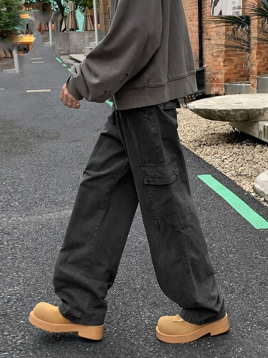 Dark grey cargo pants with button flap pockets