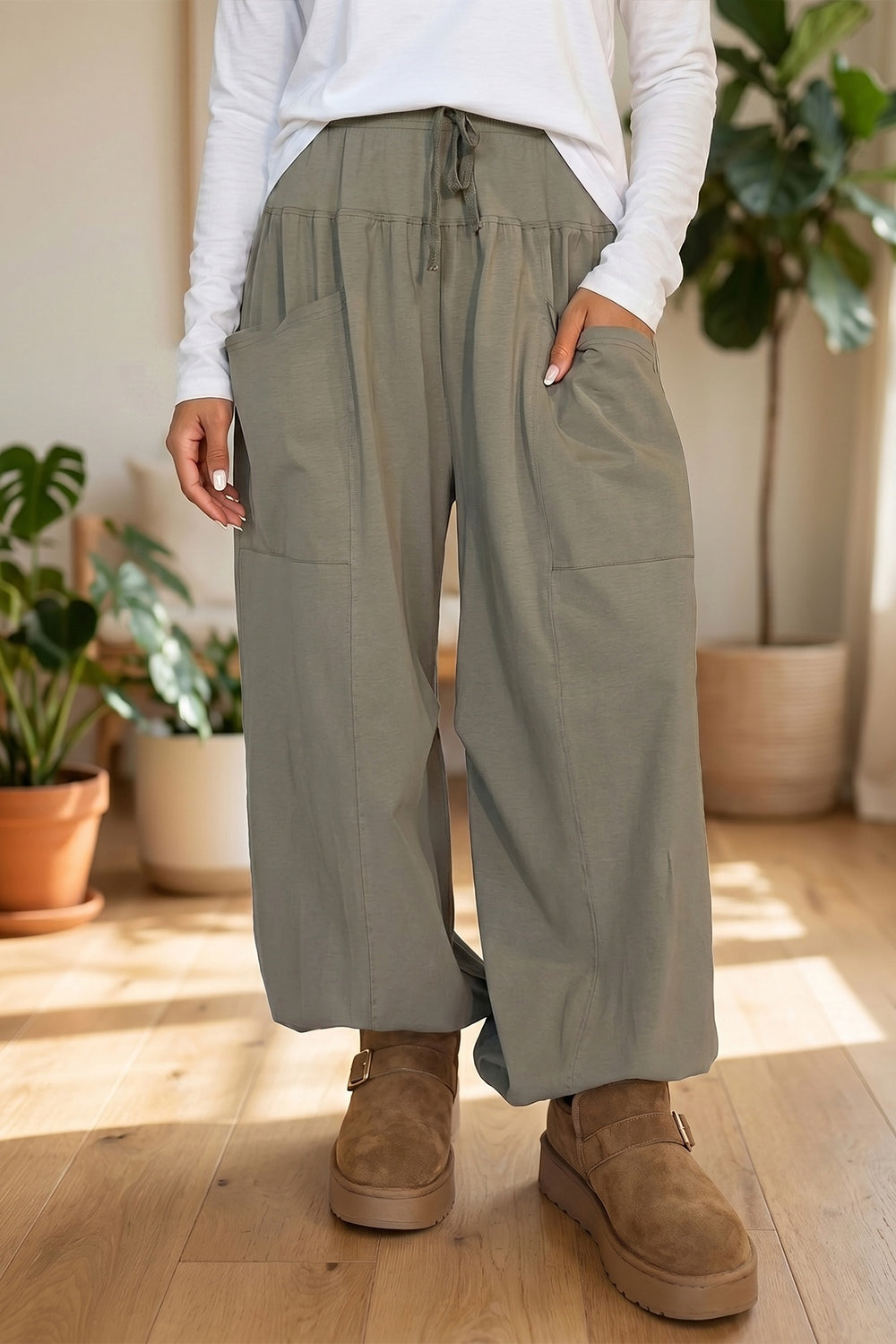 wide-leg pants in sage green featuring drawstring waist and wide-leg fit