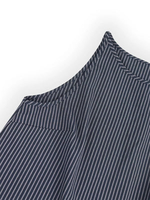Blue striped sleeveless top detail with sharp shoulder seam and pocket flap.