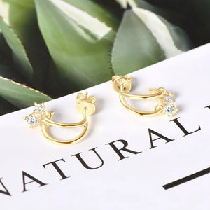 Gold cubic drop hoop earrings with clear cubic zirconia accents