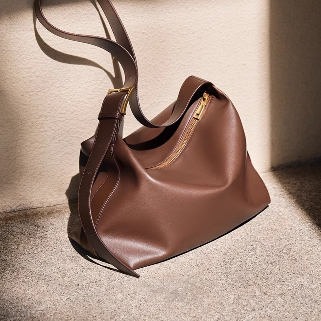Caramel pu leather shoulder bag with gold buckle and zipper detail