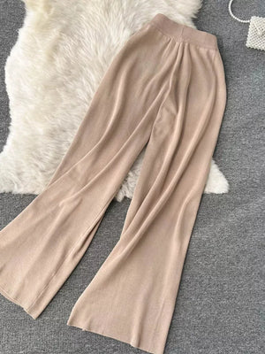 Khaki knit wide leg pants with a tied waist and elastic waistband.