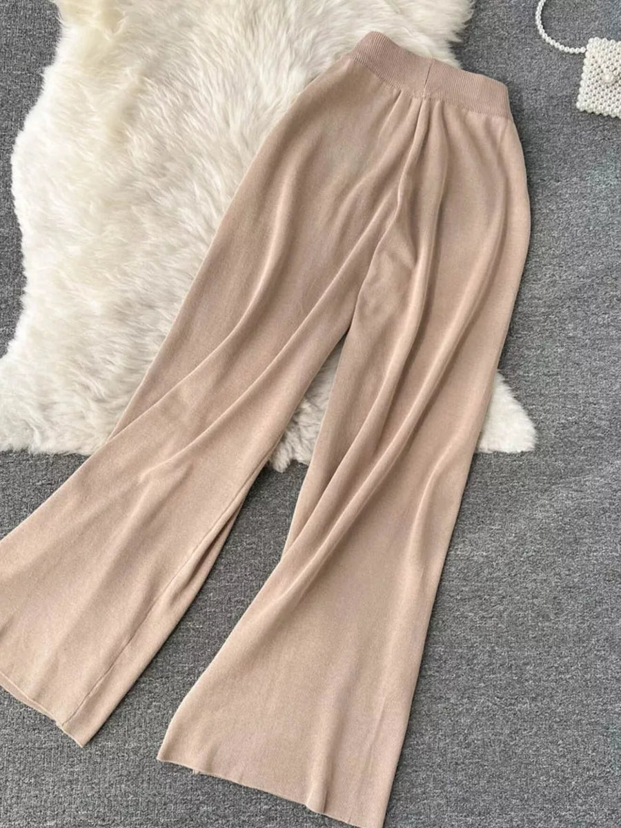 Khaki knit wide leg pants with a tied waist and elastic waistband.