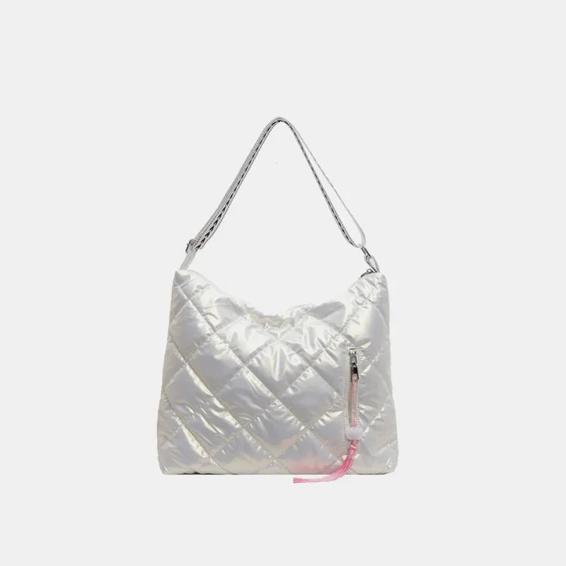 White diamond quilt padded shoulder bag with a pink tassel zipper detail.