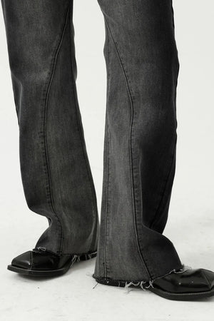 Dark wash cotton flare jeans with seam detail and raw hem