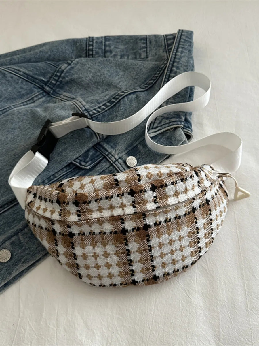 Textured houndstooth belt bag with white adjustable strap