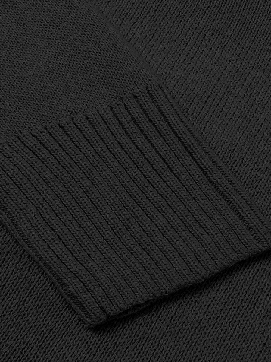 Black knit sweater with ribbed trim detail on cuff