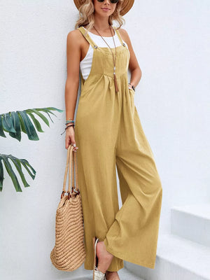 Light Yellow wide-leg romper with pockets and adjustable straps, styled with a white tank top.